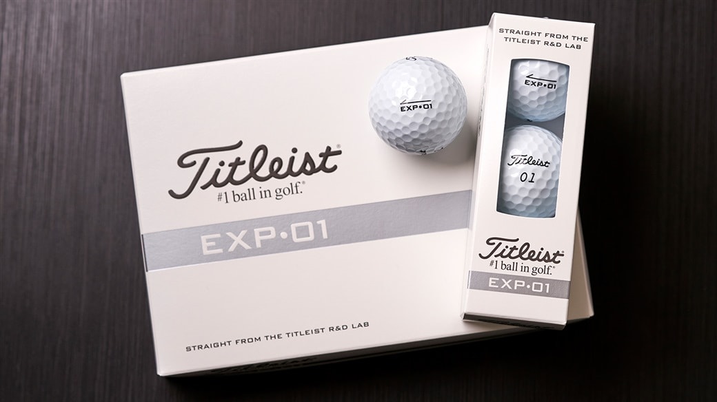 Photo of new Titleist EXP•01 golf ball dozen, 3-ball sleeve and single ball