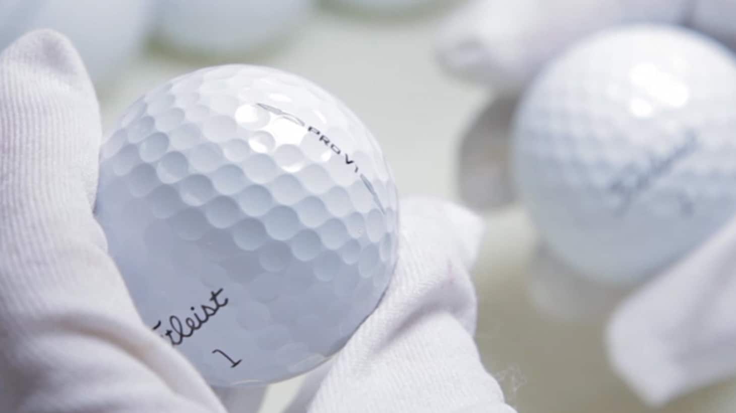  A Titleist associate hand inspects Pro V1 golf balls after the stamping process.